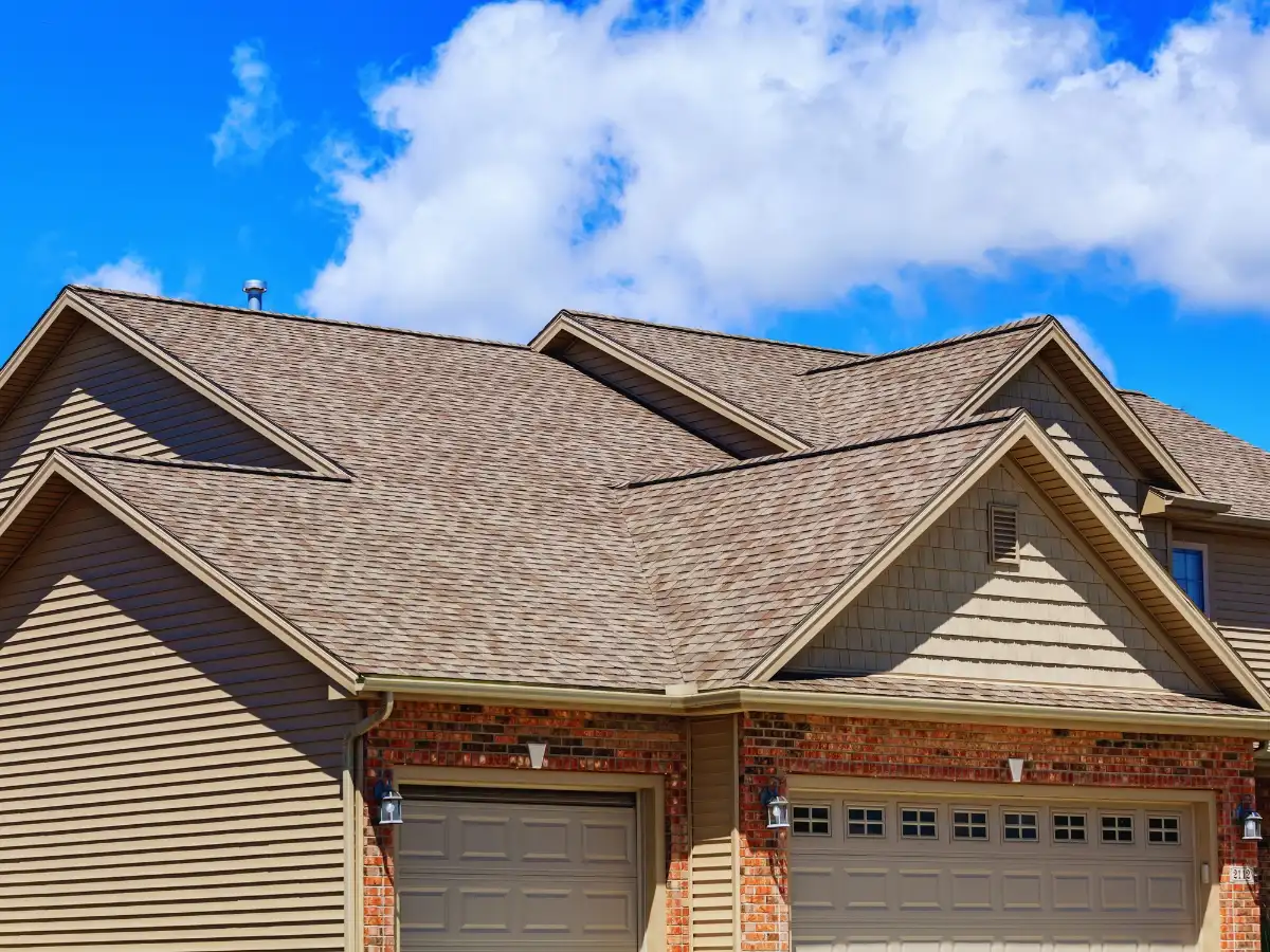 Homeowner reviewing architectural shingle colors for a roof replacement